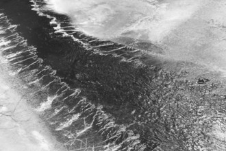Black and white photograph of a flowing river with moving water, Kamptal Waldviertel Lower Austria