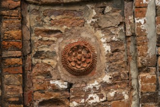 Detailed floral pattern in ancient brickwork in a rustic architectural setting-Dhaka, Bangladesh