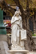 A classic marble statue with a dove on its head, surrounded by autumnal trees and rustic scenery, A