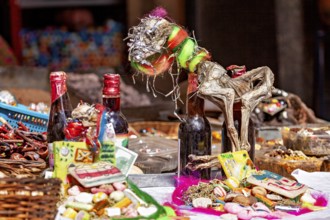 Traditional market stalls with colourful handicrafts and decorative objects, in a lively and