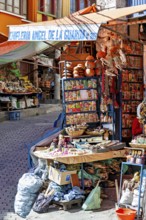 A stall at an Andean market with spices and colourful packaging, traditionally decorated, The