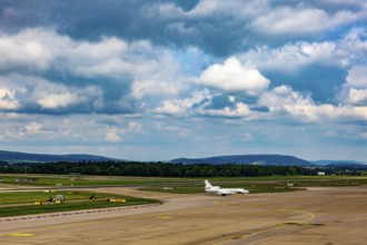 Private Jet Airplane Taxiing on Runway in a Sunny Summer Day From the Airport in Kloten, Zurich,