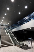 Inside Illuminated Zurich Airport with Escalator at Night in the Airport in Kloten, Zurich, Zurich