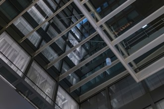 Modern Illuminated Office Building to Zurich Airport at Night in the Airport in Kloten, Zurich,
