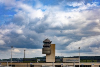 Air Traffic Control Tower on the Airfield in a Sunny Summer Day with Blue Sky and Clouds From the