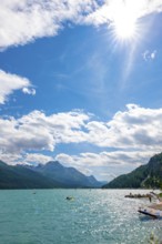 Windsurfing and Wingsurfing on Alpine Lake Silvaplana in a Sunny Summer Day with Mountain View in