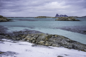 Norway tromsö snow mountains sea turquoise beach