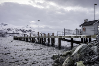 Norway tromsö snow mountains sea house jetty