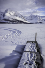 Norway tromsö snow mountains lake jetty frozen