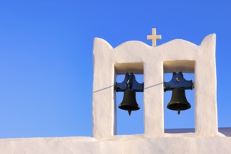 Sunrise serenity over Sifnos Iconic bells tower, Sifnos, Cyclades Islands, Greece