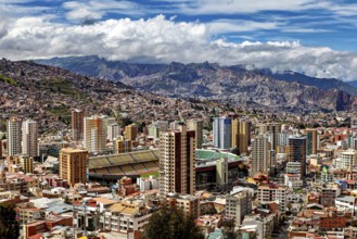 City view with skyscrapers and mountain landscape in the background, The houses and skyscrapers of