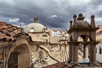 Historic roofs of a church with a dramatic sky in the background, San Fransisco Cathedral in La Paz