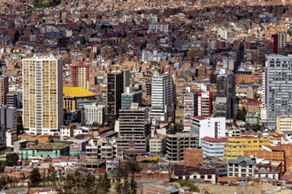 Aerial view of a city with many high-rise buildings and dense development, The houses and