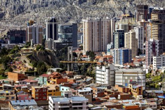 Urban landscape of La Paz with modern skyscrapers and bridge between hills, The houses and