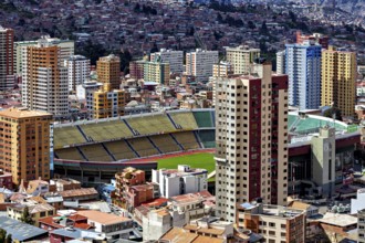 Cityscape with a large stadium surrounded by skyscrapers, The houses and skyscrapers of the city