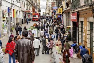 Busy street in a city with many people and shops in La Paz, people in the city centre of La Paz in