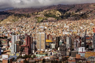 Dense cluster of houses of La Paz embedded in a hilly landscape, The houses and skyscrapers of the