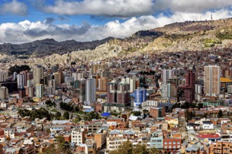Sweeping panoramic view of the city, surrounded by mountains, The houses and skyscrapers of the