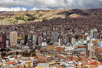 Dense development of a city with many high-rise buildings and clouds, The houses and skyscrapers of