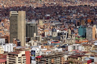 A large cathedral surrounded by modern skyscrapers, The houses and skyscrapers of the city centre