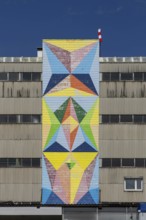 Geometric mural in bright colours on industrial façade, at the port of Linz Upper Austria Austria