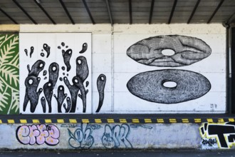 Abstract shapes and graphic patterns in black and white on a wall, at the harbour in Linz, Upper