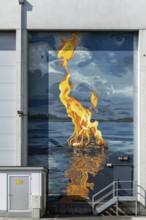 Fire flame on water surface as realistic wall painting, at the harbour Linz Upper Austria Austria