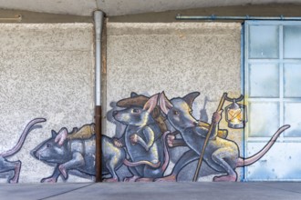 Imaginative depiction of mice with a lantern as wall graffiti, at Linz harbour Upper Austria