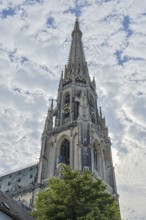 Gothic church tower rises high into the sky with detailed architecture, Linz Upper Austria Austria
