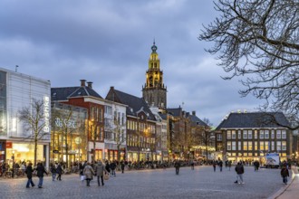 Shops at the fish market Vismarkt and the church tower Martinitoren or Martinitower of the