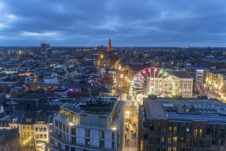Groningen with the Ferris wheel on the Grote Markt seen from above at dusk, Netherlands