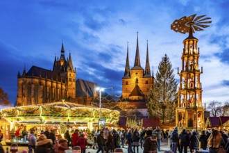 Christmas market with Christmas pyramid in front of Erfurt Cathedral and the Church of St Severus