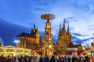 Christmas market with Christmas pyramid in front of Erfurt Cathedral and the Church of St Severus