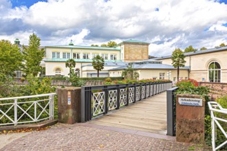 Promenade and arcade footbridge on the Franconian Saale in Bad Kissingen, Bavaria, Germany