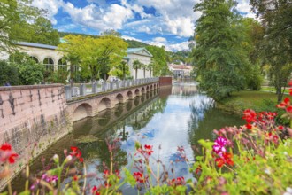 Promenade and arcade footbridge on the Franconian Saale in Bad Kissingen, Bavaria, Germany