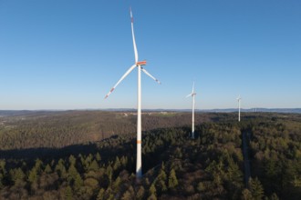 A wind farm with several turbines on a hill surrounded by forests, near Schorndorf in the Rems