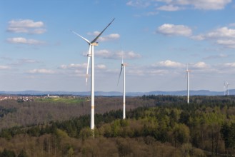 Wind turbines in a hilly, wooded area under a clear sky, maintenance work, repair, near Schorndorf