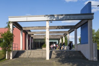 Teenagers leaving the indoor swimming pool, Aqua Riese, Bad Staffelstein, Upper Franconia,