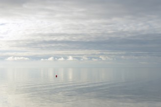North Sea coast, special light atmosphere over the Wadden Sea with rising water and calm wind, red
