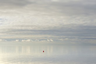North Sea coast, special light atmosphere over the Wadden Sea with rising water and calm wind, red