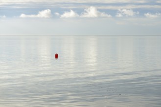 North Sea coast, special light atmosphere over the Wadden Sea with rising water and calm wind, red