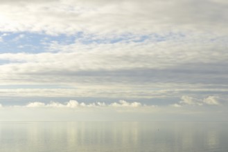 North Sea coast, special light atmosphere over the Wadden Sea with rising water and calm wind,