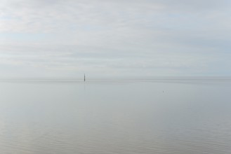 North Sea coast, special light atmosphere over the Wadden Sea with rising water and calm wind,