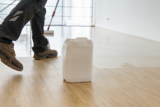 Professional sealing of a new parquet floor with lacquer