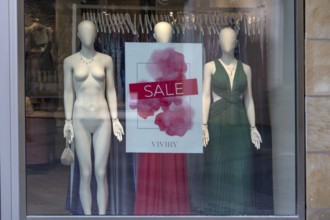 Nude and clothed mannequins in a fashion shop for sale, Bavaria, Germany
