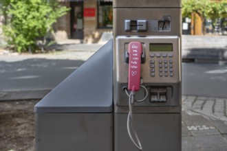 Handset and dialling keypad of a Telekom public telephone pillar, detail, Nuremberg, Central