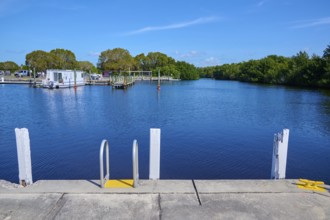 Harbour with jetty, calm water and clear sky, Flamingo Marina, Everglades National Park, Florida,