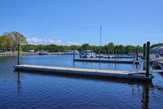 Harbour with jetties and boats under blue sky, surrounded by trees, Flamingo, Marina, Everglades