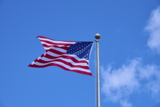 American flag fluttering against a clear blue sky on a sunny day, Flamingo, Everglades National
