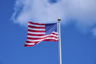 The American national flag flutters vividly under a sunny sky, Flamingo, Everglades National Park,